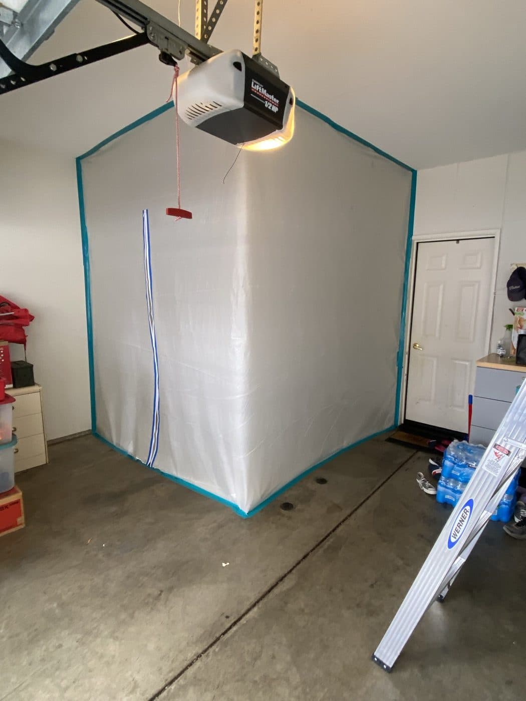 Sealed containment enclosure built inside a residential garage